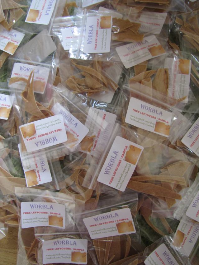 Photo by Anathiell. Free worbla samples which were leftovers from cosplay projects to hand out at her table at conventions.  That’s right nothing goes to waste, make use of what you have.