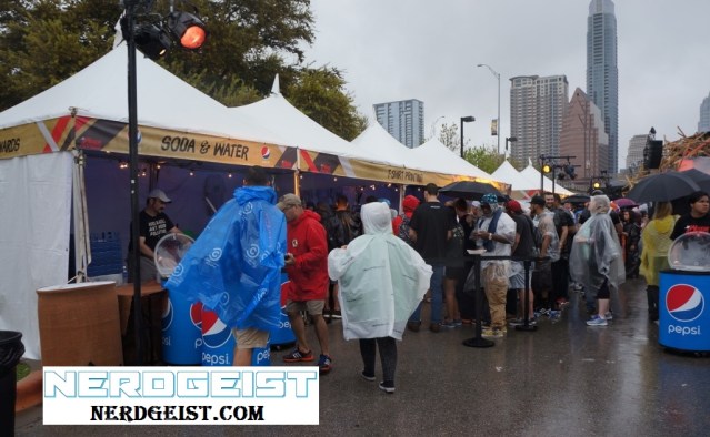 Fans queue for the free drinks and T-Shirt printing.