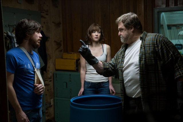 John Goodman as Howard, Mary Elizabeth Winstead as Michelle, and John Gallagher Jr. as Emmett in 10 CLOVERFIELD LANE, by Paramount Pictures